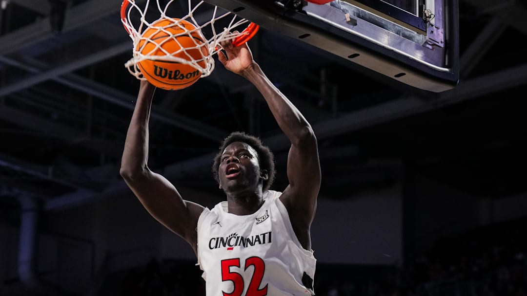Feb 8, 2026; Cincinnati, Ohio, USA; Cincinnati Bearcats center Moustapha Thiam (52) dunks the ball against the UCF Knights in the first half at Fifth Third Arena. Mandatory Credit: Aaron Doster-Imagn Images Feb 8, 2026; Cincinnati, Ohio, USA; Cincinnati Bearcats center Moustapha Thiam (52) dunks the ball against the UCF Knights in the first half at Fifth Third Arena. Mandatory Credit: Aaron Doster-Imagn Images
