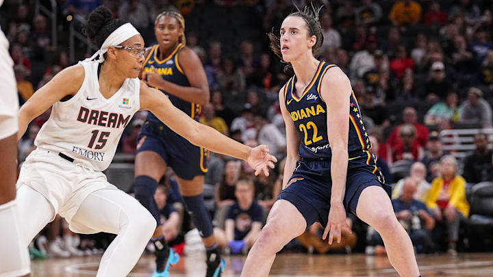 May 9, 2024; Indianapolis, IN, USA; Indiana Fever guard Caitlin Clark (22) rushes up the court against Atlanta Dream guard Allisha Gray (15) on Thursday, May 9, 2024, during the preseason game against the Atlanta Dream at Gainbridge Fieldhouse in Indianapolis. The Indiana Fever defeated the Atlanta Dream, 83-80. Mandatory Credit: Grace Hollars-Imagn Images