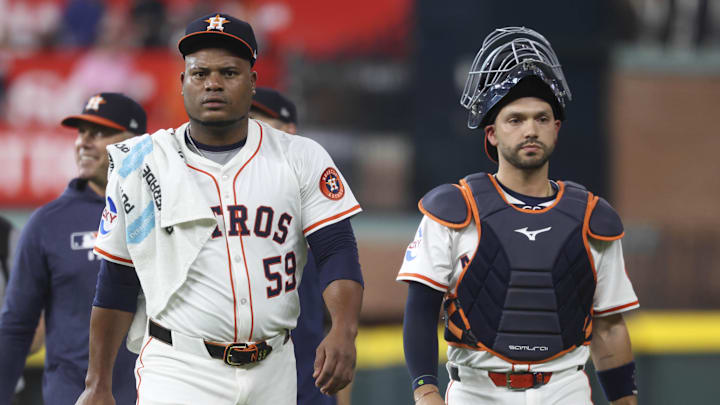 Houston Astros starting pitcher Framber Valdez (59) and catcher Cesar Salazar (18) walk to the dugout before the game against the New York Yankees at Daikin Park on Sept. 2.
