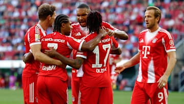 Bayern Munich players celebrating goal against Augsburg.