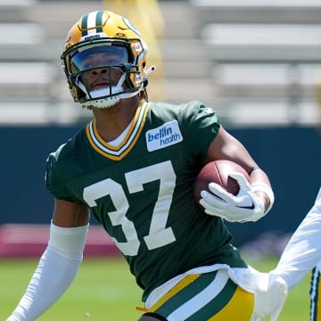 Carrington Valentine (37) goes through drills during Green Bay Packers OTAs.