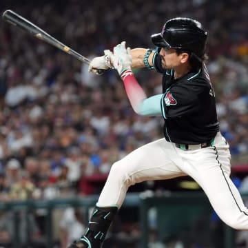 Sep 2, 2024; Phoenix, Arizona, USA; Arizona Diamondbacks outfielder Corbin Carroll (7) bats against the Los Angeles Dodgers during the seventh inning at Chase Field. Mandatory Credit: Joe Camporeale-USA TODAY Sports