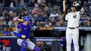 Oct 28, 2024; New York, New York, USA; New York Yankees second baseman Gleyber Torres (25) reacts after being called out on strikes by MLB umpire Mark Carlson (6) during the seventh inning against the Los Angeles Dodgers in game three of the 2024 MLB World Series at Yankee Stadium. Mandatory Credit: Brad Penner-Imagn Images