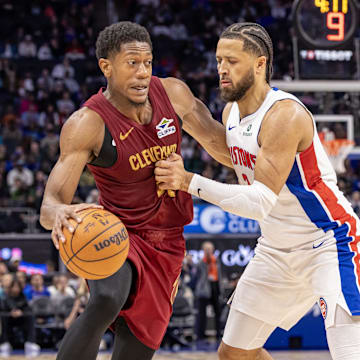 Oct 27, 2025; Detroit, Michigan, USA; Detroit Pistons guard Cade Cunningham (2) defends against Cleveland Cavaliers forward De'Andre Hunter (12) during the second half at Little Caesars Arena. Mandatory Credit: David Reginek-Imagn Images