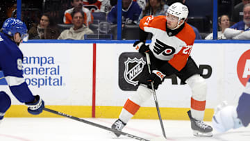 Mar 17, 2025; Tampa, Florida, USA;  Philadelphia Flyers left wing Noah Cates (27) skates with the puck against the Tampa Bay Lightning during the second period at Amalie Arena. 