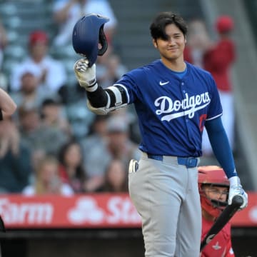 Mar 26, 2024; Anaheim, California, USA; Los Angeles Dodgers designated hitter Shohei Ohtani (17) acknowledges the crowd prior to his first at bat in the first inning against the Los Angeles Angels at Angel Stadium. Mandatory Credit: Jayne Kamin-Oncea-USA TODAY Sports