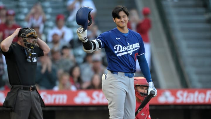 Mar 26, 2024; Anaheim, California, USA; Los Angeles Dodgers designated hitter Shohei Ohtani (17) acknowledges the crowd prior to his first at bat in the first inning against the Los Angeles Angels at Angel Stadium. Mandatory Credit: Jayne Kamin-Oncea-USA TODAY Sports