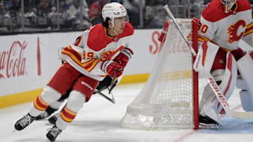 Apr 17, 2025; Los Angeles, California, USA;  Calgary Flames defenseman Zayne Parekh (89) handles the puck during the second period against the Los Angeles Kings at Crypto.com Arena. Mandatory Credit: Jayne Kamin-Oncea-Imagn Images