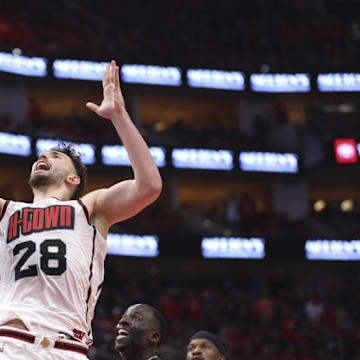 May 4, 2025; Houston, Texas, USA; Houston Rockets center Alperen Sengun (28) shoots the ball as Golden State Warriors forward Draymond Green (23) defends during game seven of the first round for the 2025 NBA Playoffs at Toyota Center. Mandatory Credit: Troy Taormina-Imagn Images