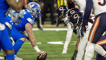 Nov 28, 2024; Detroit, Michigan, USA; Detroit Lions center Frank Ragnow (77) gets set to hike the ball against the Chicago Bears during the first half at Ford Field.