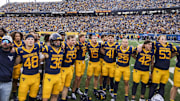 Nov 8, 2025; Morgantown, West Virginia, USA; West Virginia Mountaineers players sing “Country Roads” after defeating the Colorado Buffaloes at Milan Puskar Stadium. Mandatory Credit: Ben Queen-Imagn Images