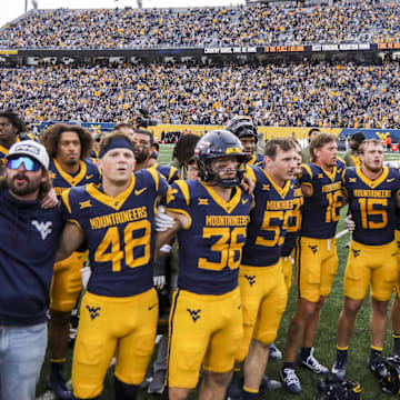 Nov 8, 2025; Morgantown, West Virginia, USA; West Virginia Mountaineers players sing “Country Roads” after defeating the Colorado Buffaloes at Milan Puskar Stadium. Mandatory Credit: Ben Queen-Imagn Images