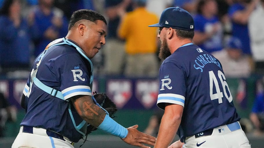 Royals catcher Salvador Pérez celebrates a win with pitcher John Schneider