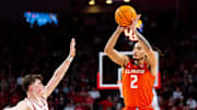 Jan 30, 2025; Lincoln, Nebraska, USA; Illinois Fighting Illini guard Dra Gibbs-Lawhorn (2) shoots a three-point shot against Nebraska Cornhuskers guard Connor Essegian (0) during the second half at Pinnacle Bank Arena. Mandatory Credit: Dylan Widger-Imagn Images
