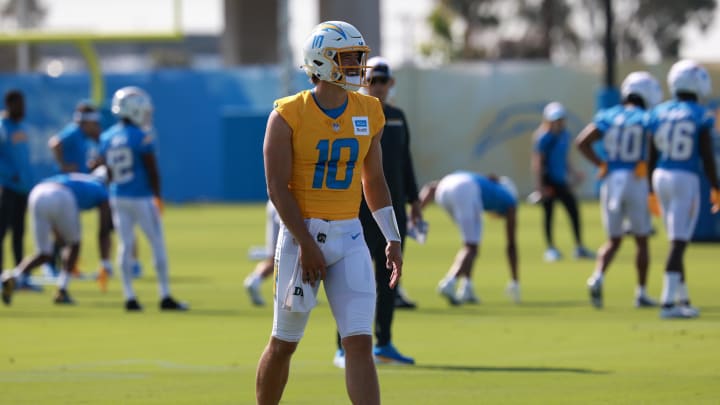 Jul 24, 2024; El Segundo, CA, USA;  Los Angeles Chargers quarterback Justin Herbert (10) walks on the field during the first day of training camp at The Bolt. Mandatory Credit: Kiyoshi Mio-USA TODAY Sports