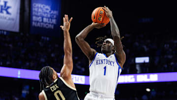 Oct 24, 2025; Lexington, KY, USA; Kentucky Wildcats guard Denzel Aberdeen (1) shoots the ball against Purdue Boilermakers guard C.J. Cox (0) during the second half at Rupp Arena at Central Bank Center. Mandatory Credit: Jordan Prather-Imagn Images