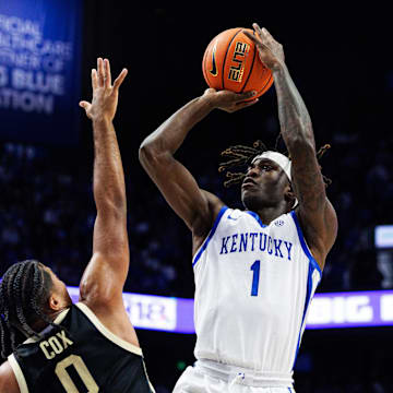 Oct 24, 2025; Lexington, KY, USA; Kentucky Wildcats guard Denzel Aberdeen (1) shoots the ball against Purdue Boilermakers guard C.J. Cox (0) during the second half at Rupp Arena at Central Bank Center. Mandatory Credit: Jordan Prather-Imagn Images