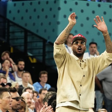 Aug 10, 2024; Paris, France; Carmelo Anthony cheers in the second half against France in the men's basketball gold medal game during the Paris 2024 Olympic Summer Games at Accor Arena. Mandatory Credit: Rob Schumacher-USA TODAY Sports