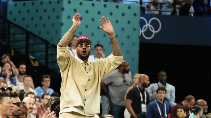 Aug 10, 2024; Paris, France; Carmelo Anthony cheers in the second half against France in the men's basketball gold medal game during the Paris 2024 Olympic Summer Games at Accor Arena. Mandatory Credit: Rob Schumacher-USA TODAY Sports