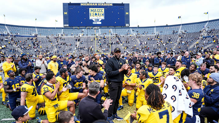 Michigan head coach Sherrone Moore, center, speaks to players after the spring game at Michigan Stadium in Ann Arbor on Saturday, April 19, 2025.