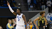 Jan 30, 2025; Los Angeles, California, USA;  UCLA Bruins guard Eric Dailey Jr. (3) celebrates after making a shot against Oregon Ducks guard Keeshawn Barthelemy (9) during the second half at Pauley Pavilion presented by Wescom. Mandatory Credit: Alex Gallardo-Imagn Images