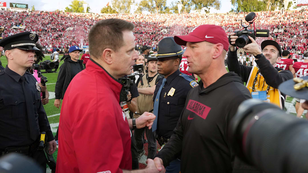Jan 1, 2026; Pasadena, CA, USA; Indiana Hoosiers head coach Curt Cignetti (left) shakes hands with Alabama Crimson Tide head coach Kalen Deboer after the 2026 Rose Bowl and quarterfinal game of the College Football Playoff at Rose Bowl Stadium. Mandatory Credit: Kirby Lee-Imagn Images