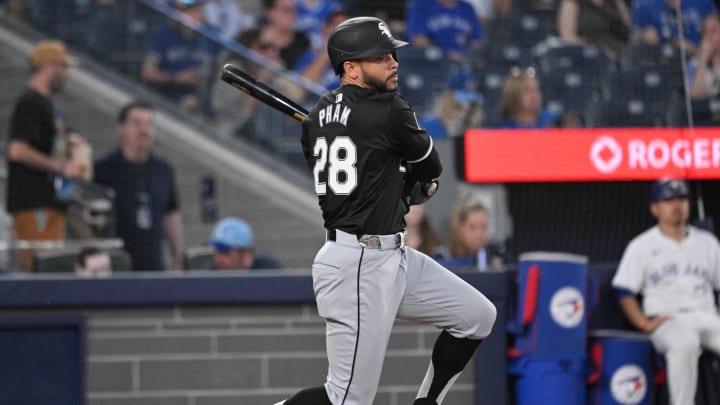 May 21, 2024; Toronto, Ontario, CAN;  Chicago White Sox center fielder Tommy Pham (28) hits a single against the Toronto Blue Jays in the seventh inning at Rogers Centre. Mandatory Credit: Dan Hamilton-USA TODAY Sports