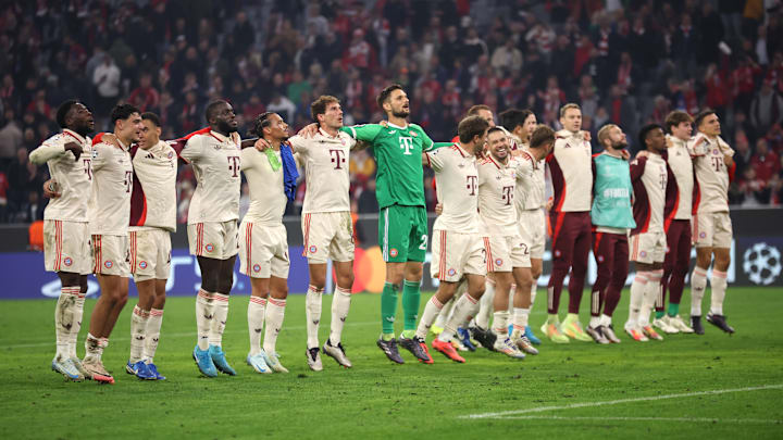 Bayern Munich players celebrating in front of fans after emphatic Champions League win against Dinamo Zagreb.