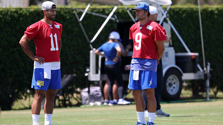Jul 31, 2024; Los Angeles, CA, USA; Los Angeles Rams quarterback Jimmy Garoppolo (11) and quarterback Matthew Stafford (9) talk during training camp at Loyola Marymount University. Mandatory Credit: Kiyoshi Mio-Imagn Images Jul 31, 2024; Los Angeles, CA, USA; Los Angeles Rams quarterback Jimmy Garoppolo (11) and quarterback Matthew Stafford (9) talk during training camp at Loyola Marymount University. Mandatory Credit: Kiyoshi Mio-Imagn Images
