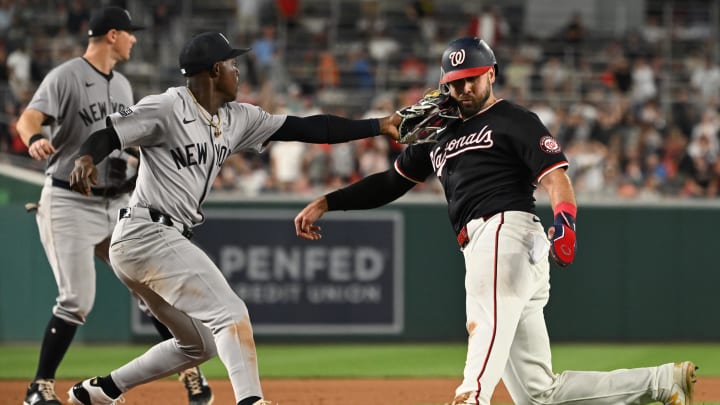 Aug 28, 2024; Washington, District of Columbia, USA; Washington Nationals first baseman Joey Gallo (24) is thrown out at third base by New York Yankees third baseman Jazz Chisholm Jr. (13) after being caught in a rundown during the eighth inning at Nationals Park. Mandatory Credit: Rafael Suanes-USA TODAY Sports