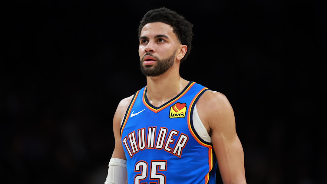 Jan 4, 2026; Phoenix, Arizona, USA; Oklahoma City Thunder guard Ajay Mitchell (25) against the Phoenix Suns at Mortgage Matchup Center. Mandatory Credit: Mark J. Rebilas-Imagn Images