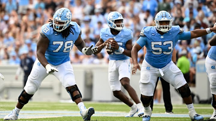 Sep 7, 2024; Chapel Hill, North Carolina, USA; North Carolina Tar Heels quarterback Conner Harrell (15) looks to pass as offensive linemen Trevyon Green (78) and Willie Lampkin (53) block in the second quarter at Kenan Memorial Stadium. Mandatory Credit: Bob Donnan-Imagn Images