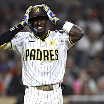 Sep 17, 2024; San Diego, California, USA; San Diego Padres left fielder Jurickson Profar (10) reacts after being hit by a pitch during the tenth inning against the Houston Astros at Petco Park. Mandatory Credit: Orlando Ramirez-Imagn Images