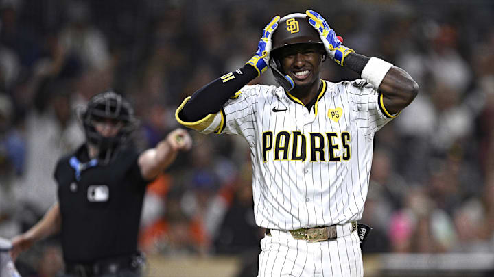 Sep 17, 2024; San Diego, California, USA; San Diego Padres left fielder Jurickson Profar (10) reacts after being hit by a pitch during the tenth inning against the Houston Astros at Petco Park. Mandatory Credit: Orlando Ramirez-Imagn Images