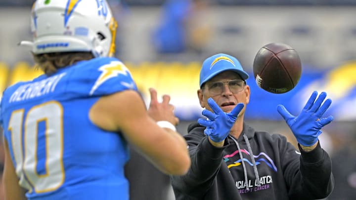 Justin Herbert and Jim Harbaugh before a game in 2024. 