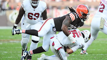 Nov 5, 2023; Cleveland, Ohio, USA; Cleveland Browns defensive end Za'Darius Smith (99) sacks Arizona Cardinals quarterback Clayton Tune (15) during the second half at Cleveland Browns Stadium. Mandatory Credit: Ken Blaze-Imagn Images