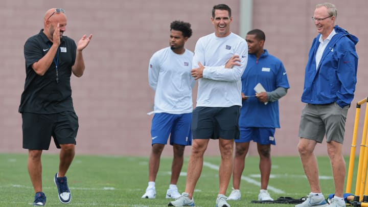 Jul 24, 2024; East Rutherford, NJ, USA; New York Giants head coach Brian Dabol, right, talks with general manager Joe Schoen, center, and president and CEO John Mara, right, during training camp at Quest Diagnostics Training Facility.  