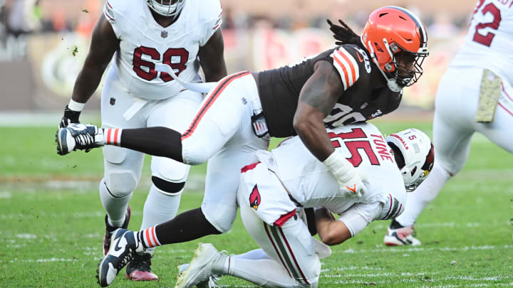 Nov 5, 2023; Cleveland, Ohio, USA; Cleveland Browns defensive end Za'Darius Smith (99) sacks Arizona Cardinals quarterback Clayton Tune (15) during the second half at Cleveland Browns Stadium.