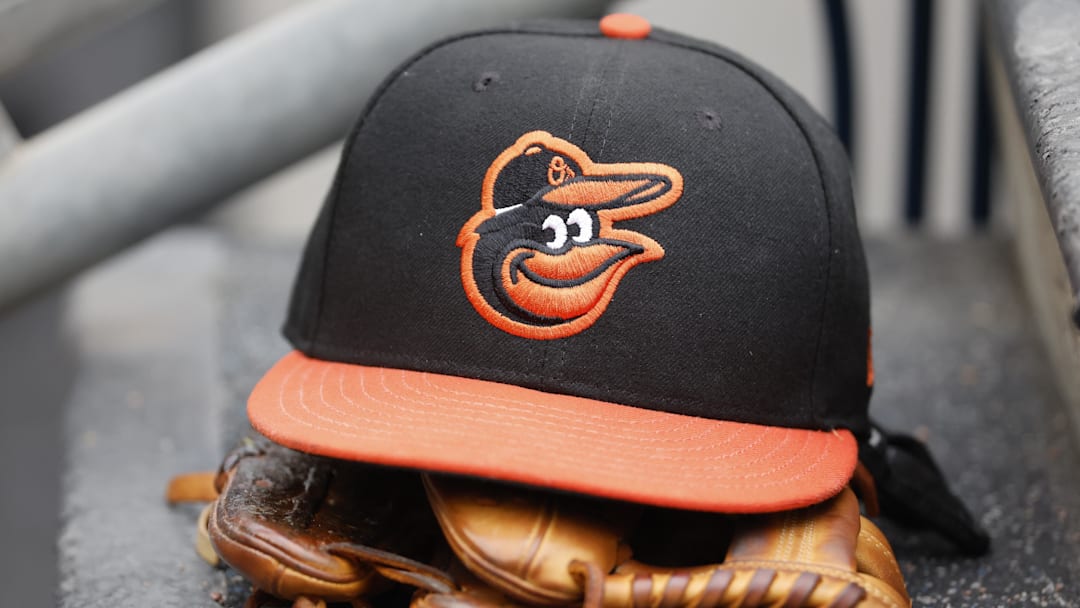 May 14, 2022; Detroit, Michigan, USA;  Baltimore Orioles cap and glove sits in dugout in the second inning against the Detroit Tigers at Comerica Park. Mandatory Credit: Rick Osentoski-Imagn Images