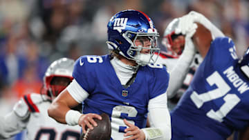 Aug 21, 2025; East Rutherford, New Jersey, USA; New York Giants quarterback Jaxson Dart (6) drops back to pass during the first half against the New England Patriots at MetLife Stadium.  
