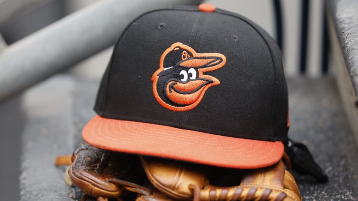 May 14, 2022; Detroit, Michigan, USA;  Baltimore Orioles cap and glove sits in dugout in the second inning against the Detroit Tigers at Comerica Park.