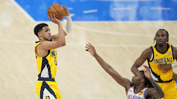 Jun 5, 2025; Oklahoma City, Oklahoma, USA; Indiana Pacers guard Tyrese Haliburton (0) shoots the ball against Oklahoma City Thunder guard Cason Wallace (22) during the fourth quarter in game one of the 2025 NBA Finals at Paycom Center. Mandatory Credit: Kyle Terada-Imagn Images