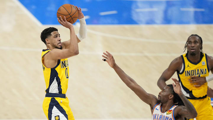 Jun 5, 2025; Oklahoma City, Oklahoma, USA; Indiana Pacers guard Tyrese Haliburton (0) shoots the ball against Oklahoma City Thunder guard Cason Wallace (22) during the fourth quarter in Game 1 of the 2025 NBA Finals on Thursday. Mandatory Credit: Kyle Terada-Imagn Images Jun 5, 2025; Oklahoma City, Oklahoma, USA; Indiana Pacers guard Tyrese Haliburton (0) shoots the ball against Oklahoma City Thunder guard Cason Wallace (22) during the fourth quarter in Game 1 of the 2025 NBA Finals on Thursday. Mandatory Credit: Kyle Terada-Imagn Images