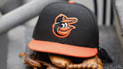 Baltimore Orioles cap and glove sits in dugout in the second inning against the Detroit Tigers at Comerica Park in Detroit on May 14, 2022.
