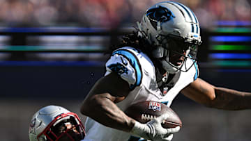 Carolina Panthers running back Rico Dowdle (5) runs against the New England Patriots during the second half at Gillette Stadium. Mandatory Credit: Brian Fluharty-Imagn Images