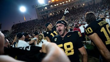 Vanderbilt Commodores linebacker Carson Casteel (58) celebrates after knocking off the Alabama Crimson Tide 40-35 at Vanderbilt Stadium in Nashville, Tenn., Saturday, Oct. 5, 2024.