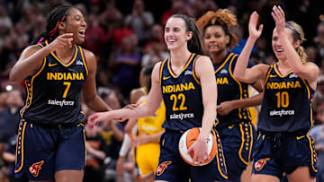 Indiana Fever forward Aliyah Boston celebrates with Indiana Fever teammates Caitlin Clark and Lexie Hull. 