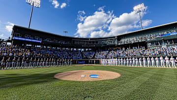 Jun 7, 2024; Chapel Hill, NC, USA; The North Carolina Tar Heels and West Virginia Mountaineers stand for the playing of the national anthem prior to the DI Baseball Super Regional at Boshamer Stadium.  Mandatory Credit: Jeffrey Camarati-Imagn Images
