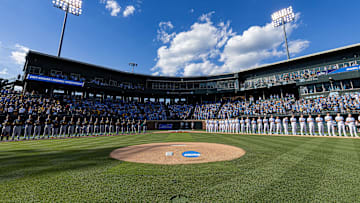 Jun 7, 2024; Chapel Hill, NC, USA; The North Carolina Tar Heels and West Virginia Mountaineers stand for the playing of the national anthem prior to the DI Baseball Super Regional at Boshamer Stadium.  Mandatory Credit: Jeffrey Camarati-Imagn Images
