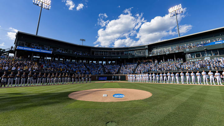 Jun 7, 2024; Chapel Hill, NC, USA; The North Carolina Tar Heels and West Virginia Mountaineers stand for the playing of the national anthem prior to the DI Baseball Super Regional at Boshamer Stadium.  Mandatory Credit: Jeffrey Camarati-USA TODAY Sports
